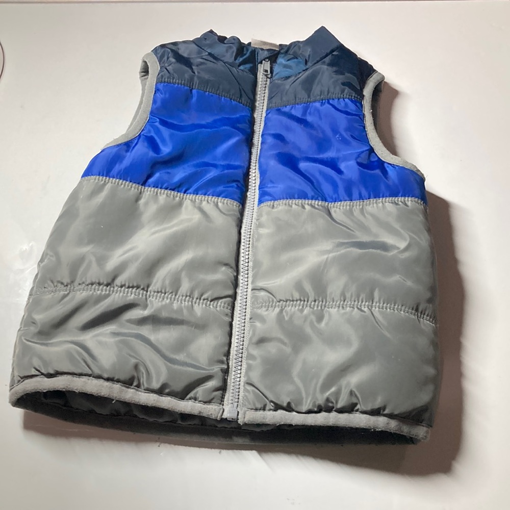 blue and gray puffer vest
